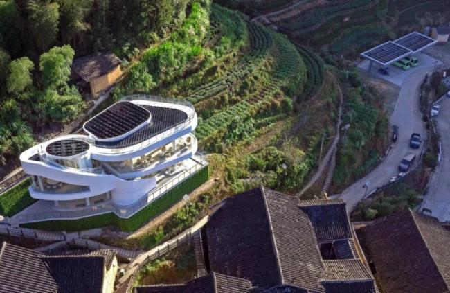 九游官網入口：這座外形酷似莫比烏斯環的建筑大有文章